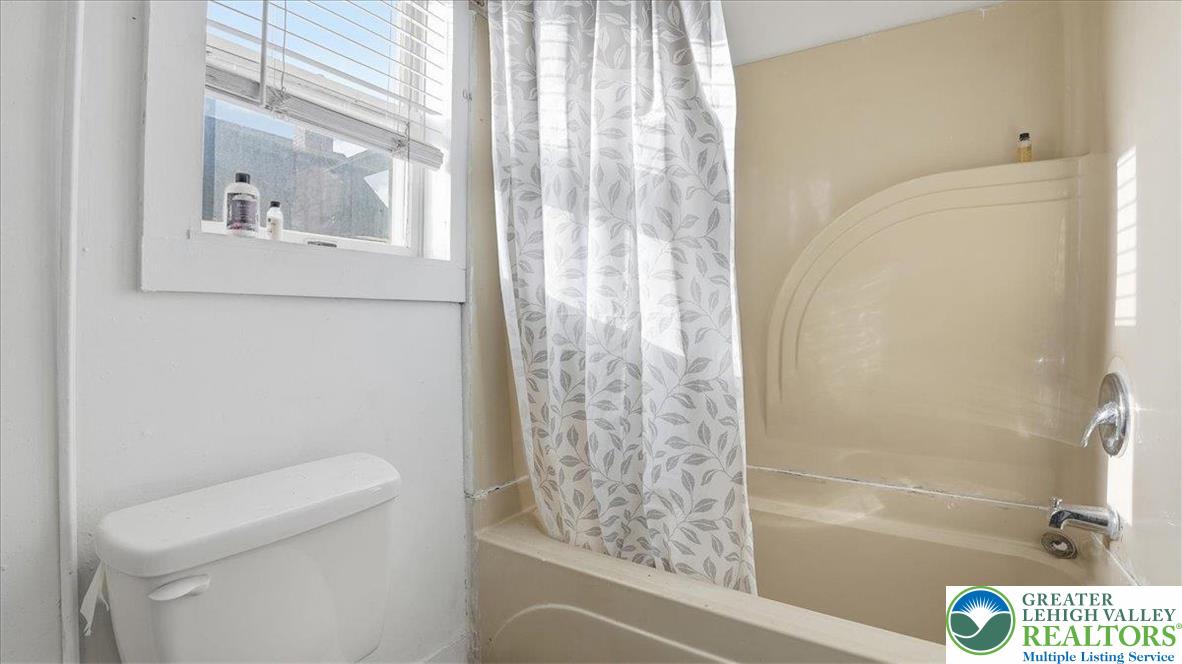 202 North Courtland Street, Unit 1 & 2 East Stroudsburg, PA 18301 - Photo 35 of 49 a bathroom with a shower and a toilet