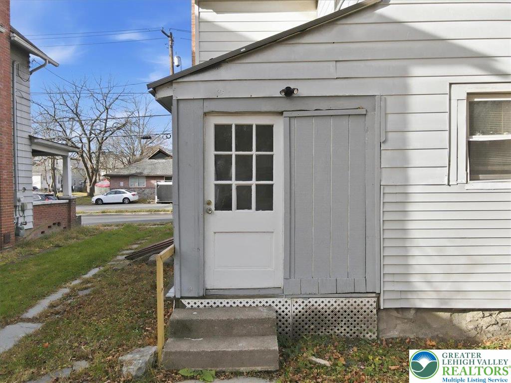 202 North Courtland Street, Unit 1 & 2 East Stroudsburg, PA 18301 - Photo 38 of 49 a front view of a house with a yard