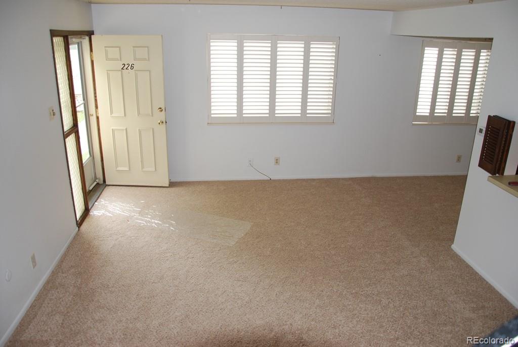 1225 South Oneida Street, Unit 226 Denver, CO 80224 - Photo 2 of 11 an empty room with windows