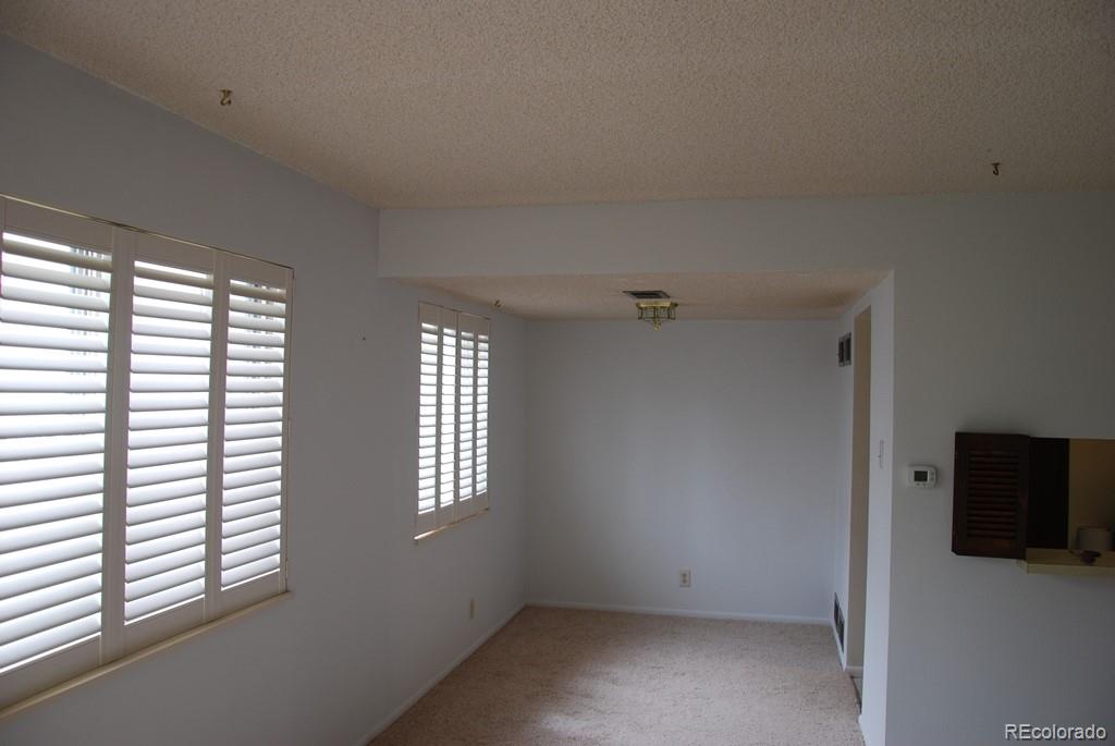 1225 South Oneida Street, Unit 226 Denver, CO 80224 - Photo 3 of 11 an empty room with windows