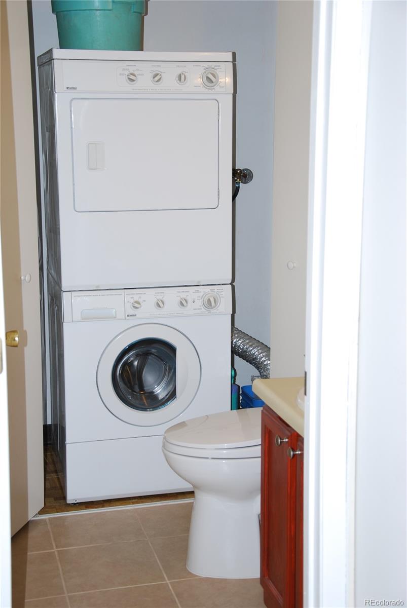 1225 South Oneida Street, Unit 226 Denver, CO 80224 - Photo 7 of 11 a utility room with dryer and washer