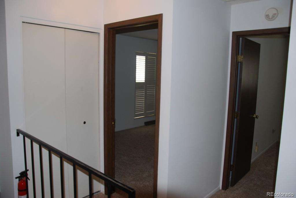 1225 South Oneida Street, Unit 226 Denver, CO 80224 - Photo 8 of 11 a view of a hallway