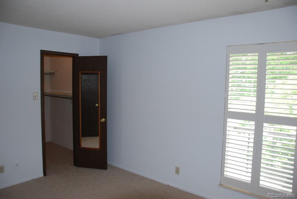 1225 South Oneida Street, Unit 226 Denver, CO 80224 - Photo 9 of 11 a view of an empty room with a window