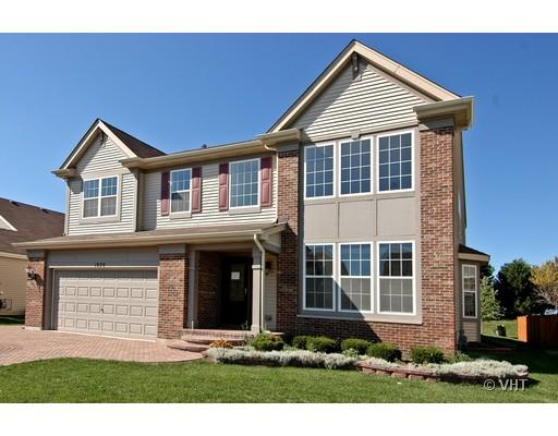 1820 Beachview Road Pingree Grove, IL 60140 - Photo 1 of 1 a front view of a house with a yard