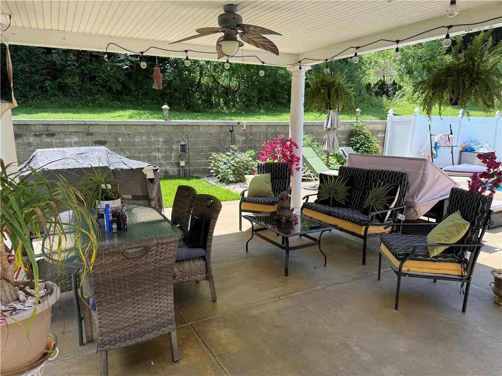 293 Sandy Hill Road Valencia, PA 16059 - Photo 11 of 50 a view of a patio with a table chairs and a backyard