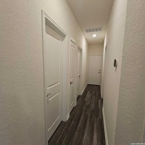 a view of a bathroom from a hallway