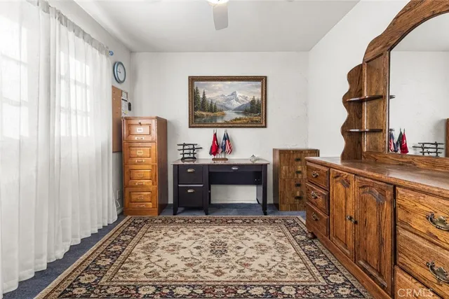 a bedroom with furniture and window