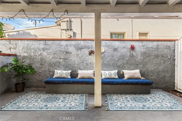 a outdoor living space with furniture and a fireplace