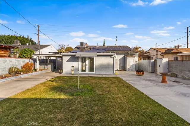a view of a house with backyard porch and sitting area