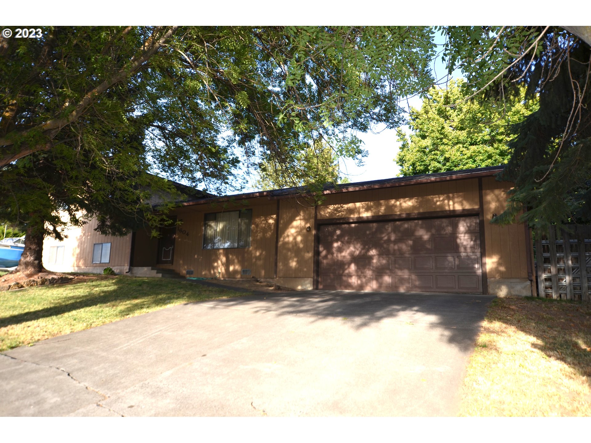 1604 Southwest 22nd Street Pendleton, OR 97801 - Photo 1 of 23 a view of a yard with a tree