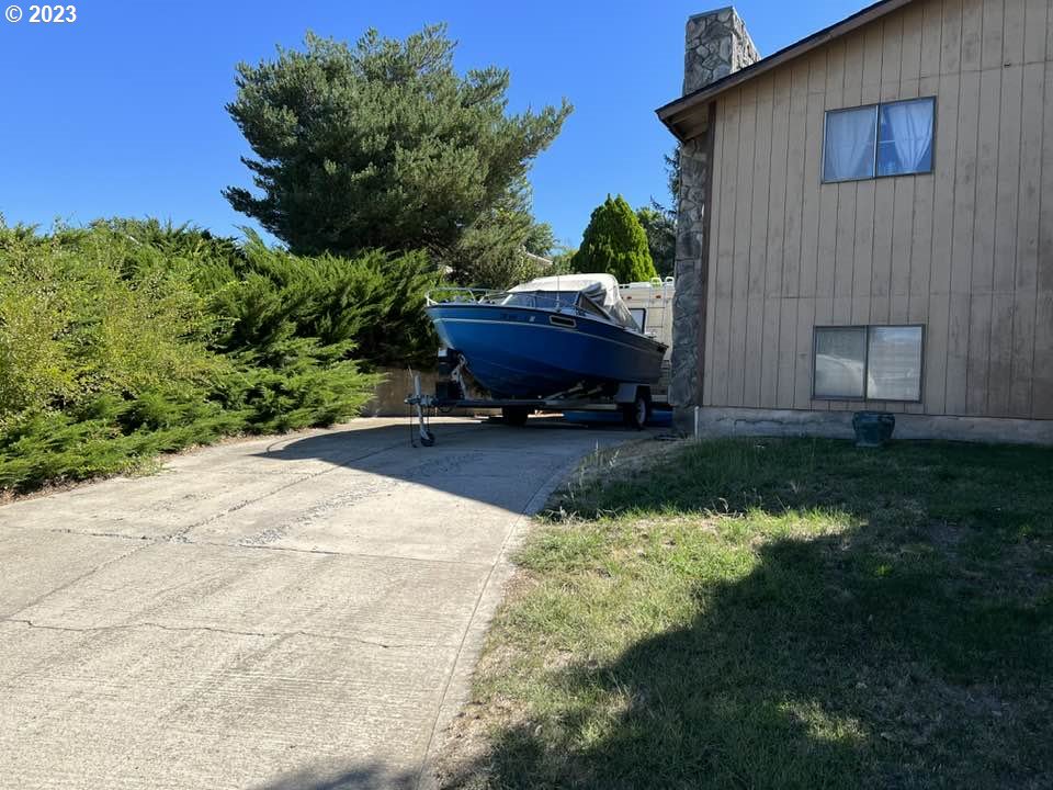 1604 Southwest 22nd Street Pendleton, OR 97801 - Photo 3 of 23 a backyard of a house with a yard fire pit and outdoor seating
