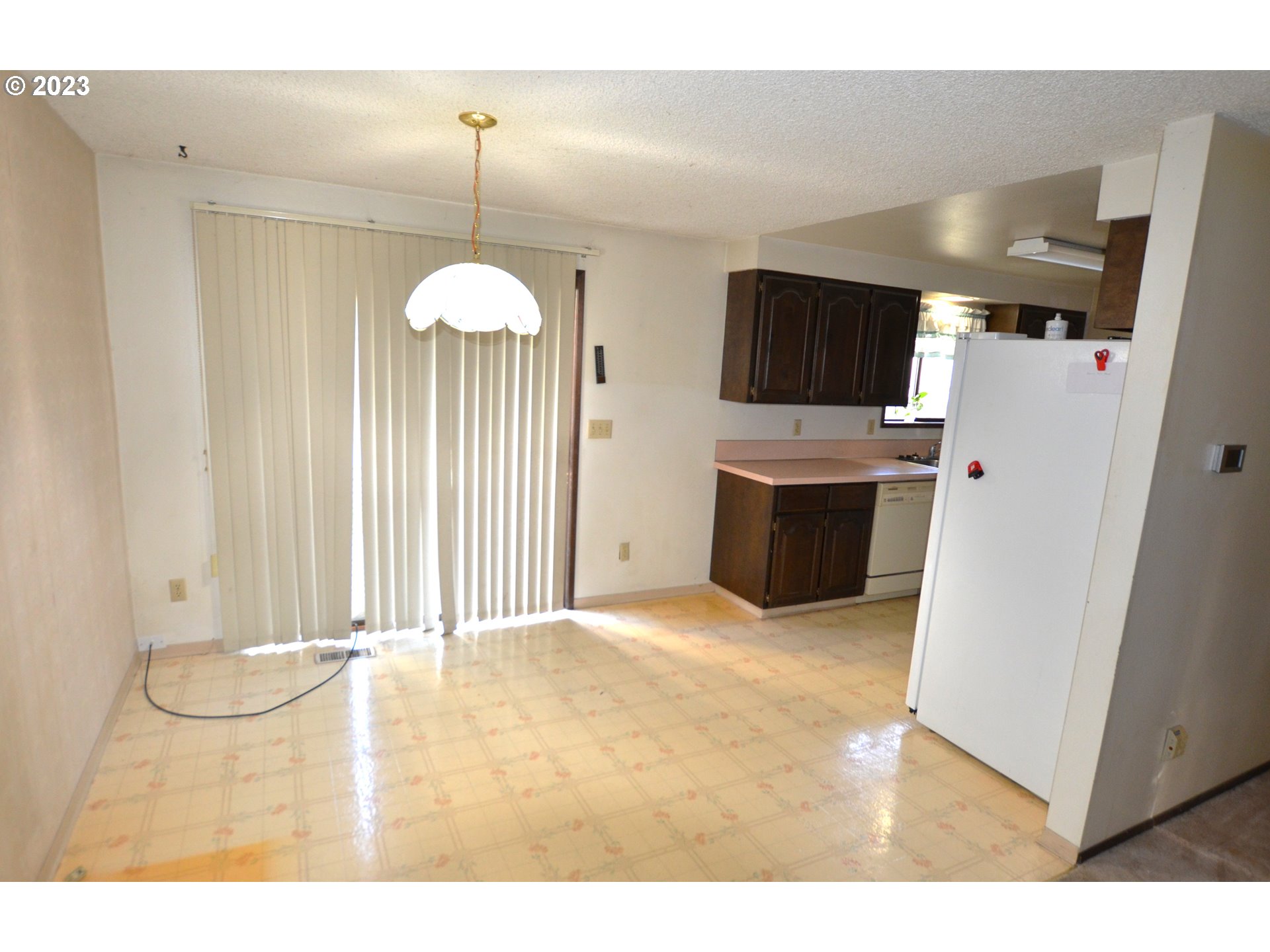 1604 Southwest 22nd Street Pendleton, OR 97801 - Photo 9 of 23 a view of a livingroom with a furniture wooden floor and a ceiling fan
