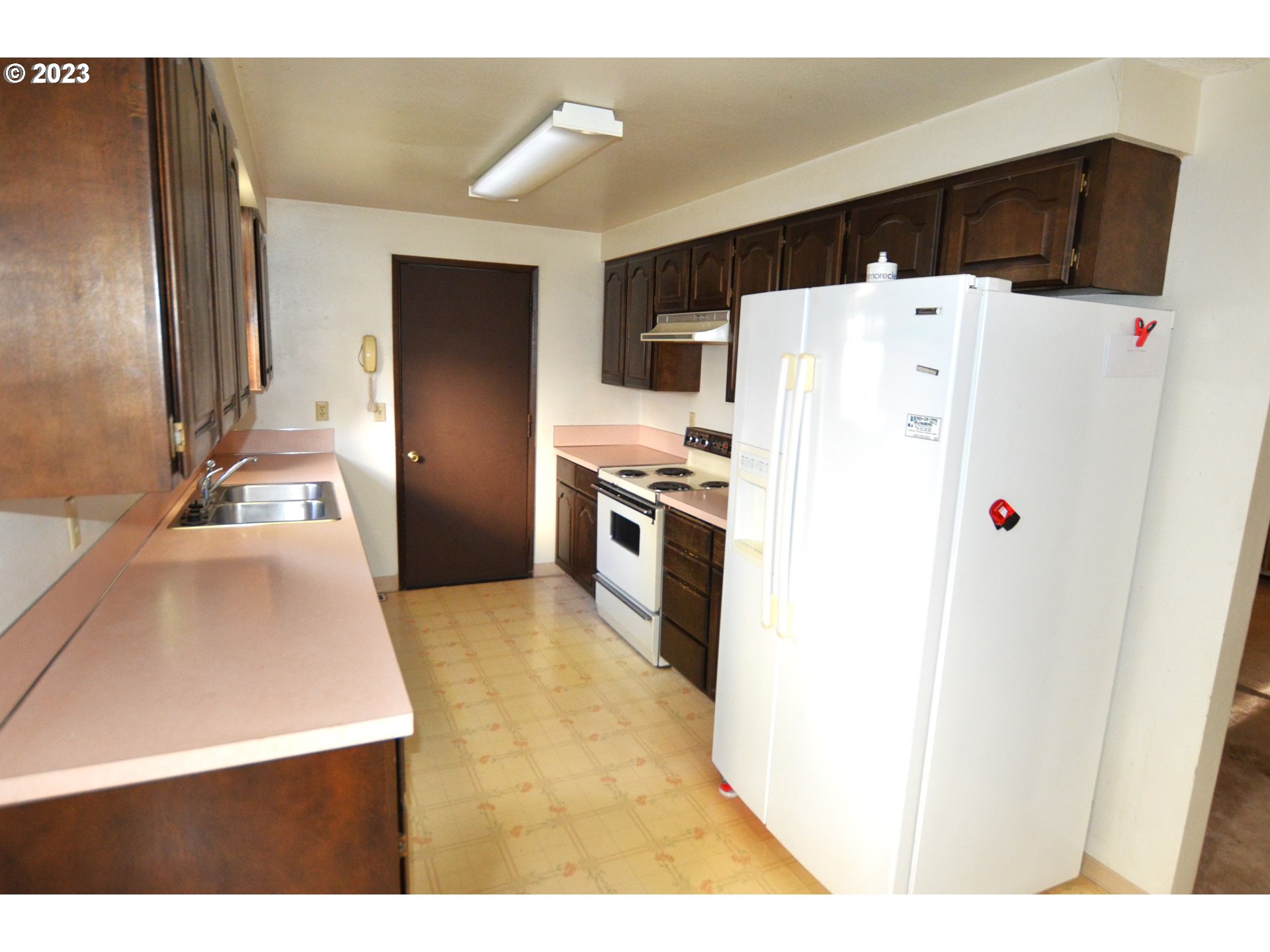 1604 Southwest 22nd Street Pendleton, OR 97801 - Photo 10 of 23 a kitchen with a refrigerator sink and stove