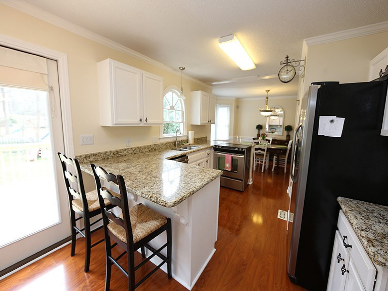6 Striding Ridge Court Durham, NC 27713 - Photo 8 of 25 Convenient breakfast bar for your morning coffee! Kitchen