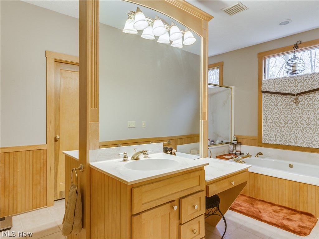 1530 Johns Road Clinton, OH 44216 - Photo 27 of 35 Double sink and vanity. Large soaker tub and seperate shower