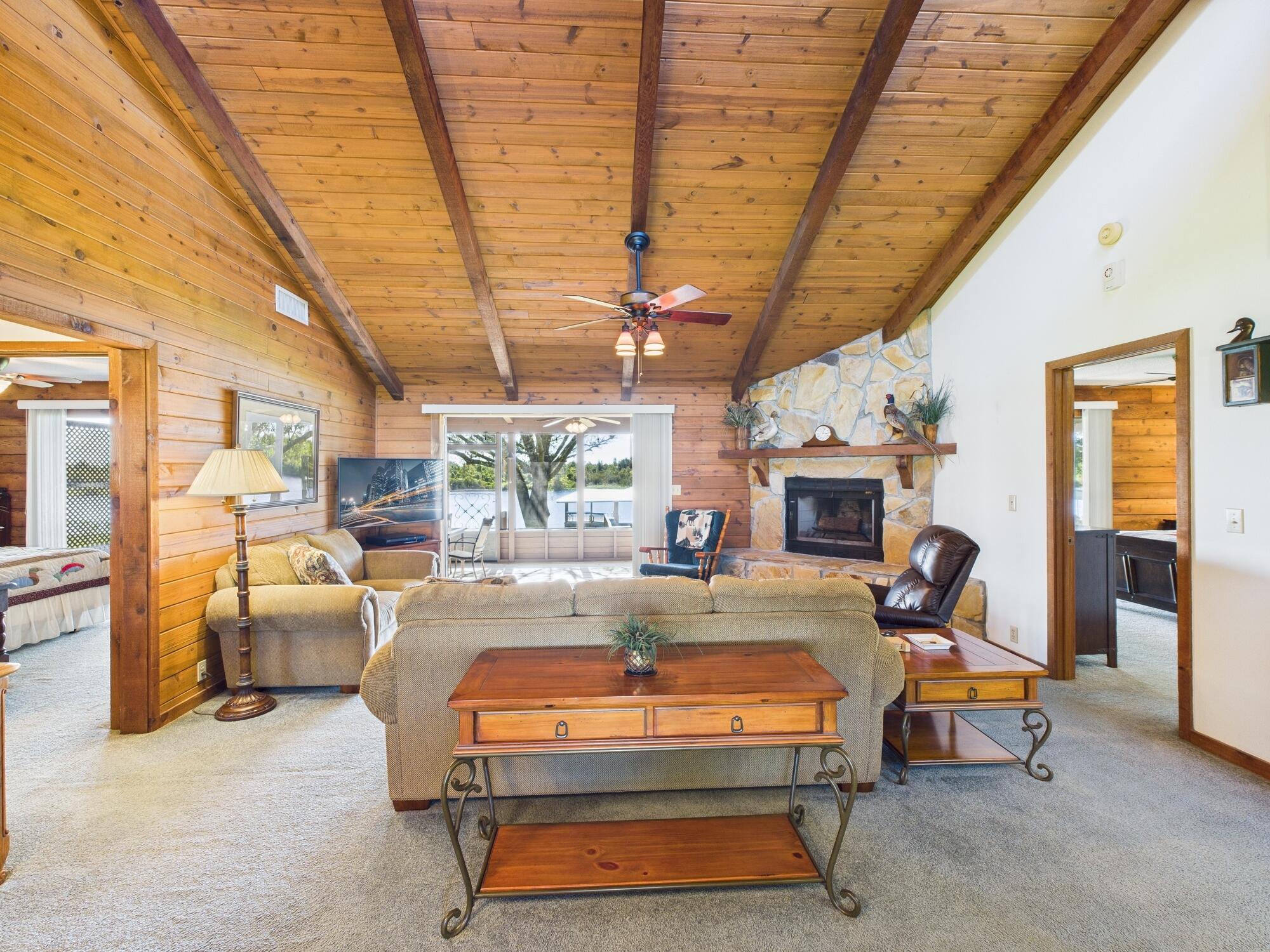 14266 Southwest 144th Parkway Okeechobee, FL 34974 - Photo 14 of 63 a living room with furniture a fireplace and a table