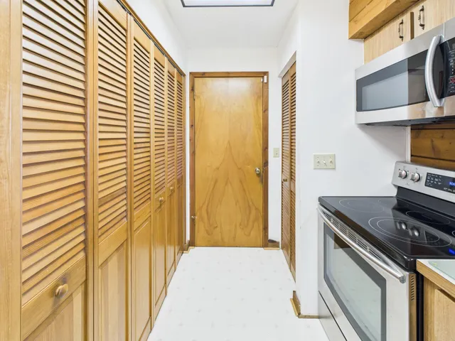 a kitchen with a sink and a window