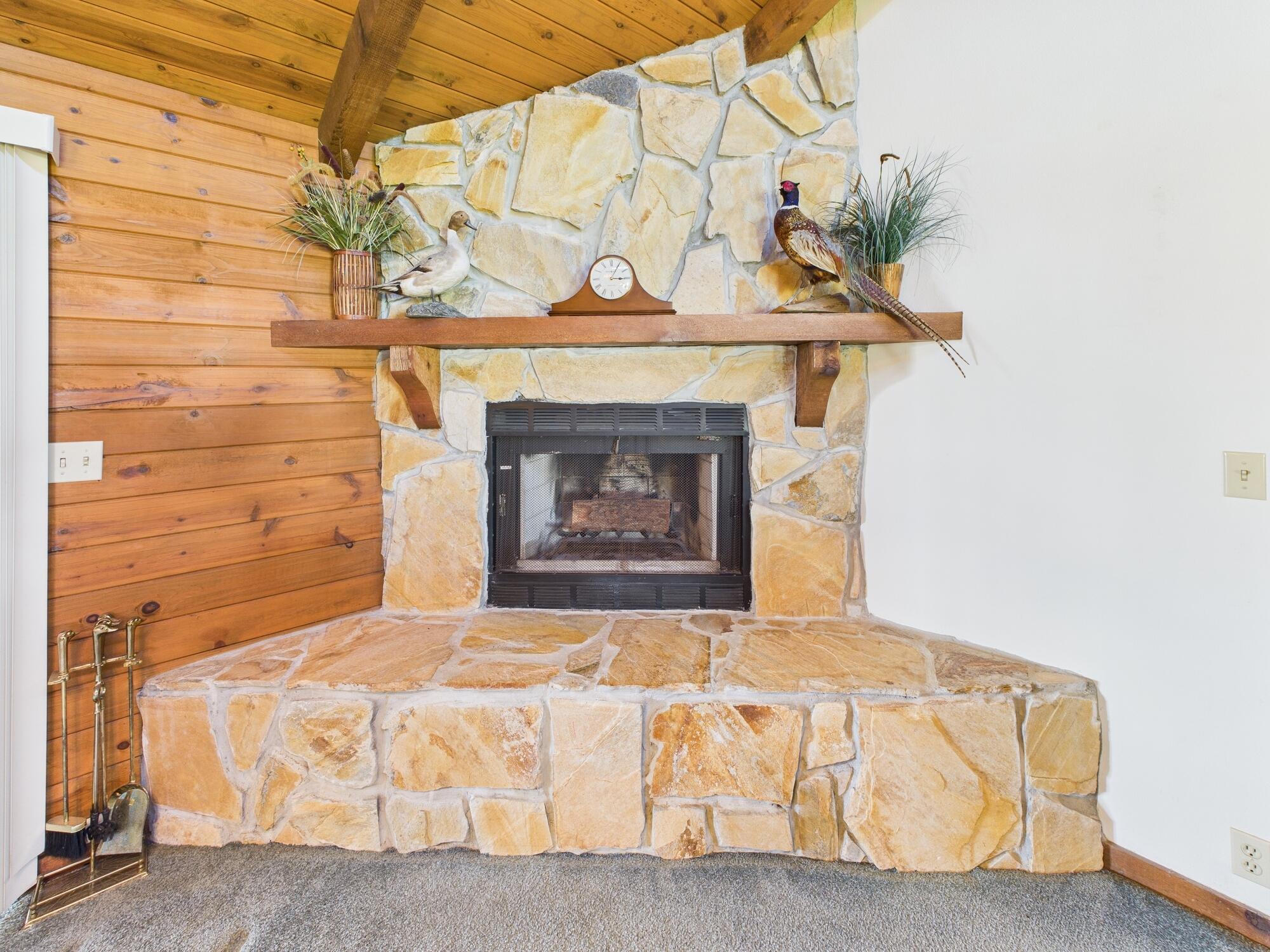 14266 Southwest 144th Parkway Okeechobee, FL 34974 - Photo 23 of 63 a bedroom with a bed and a fireplace