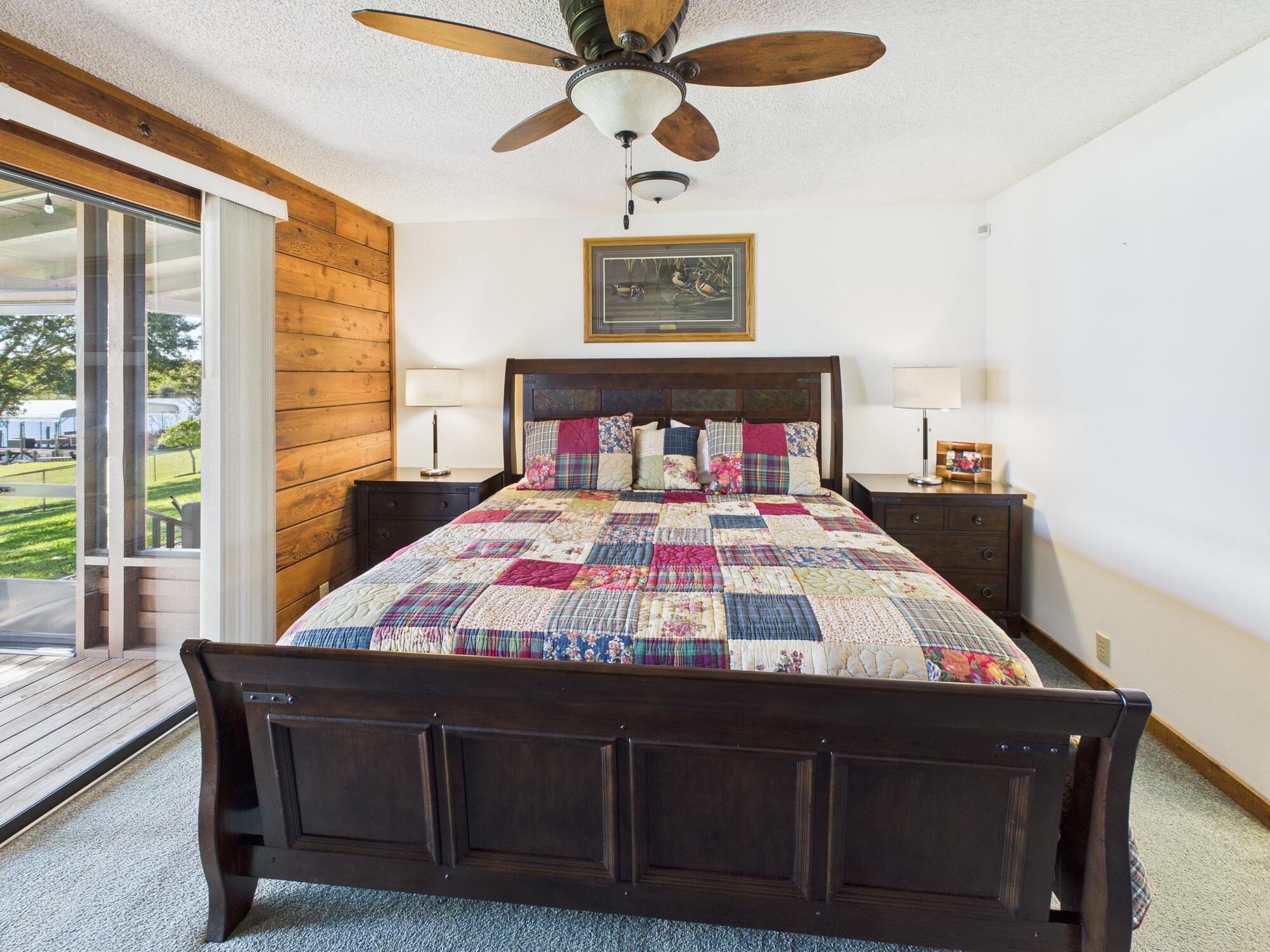 14266 Southwest 144th Parkway Okeechobee, FL 34974 - Photo 24 of 63 a bedroom with a bed dresser and a large window