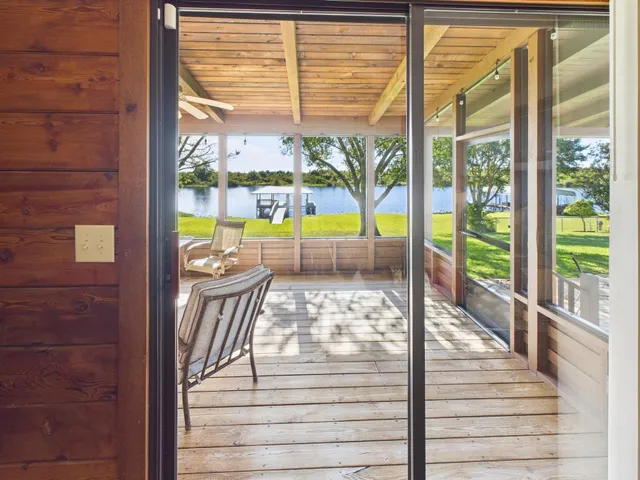 a white toilet sitting next to a shower curtain