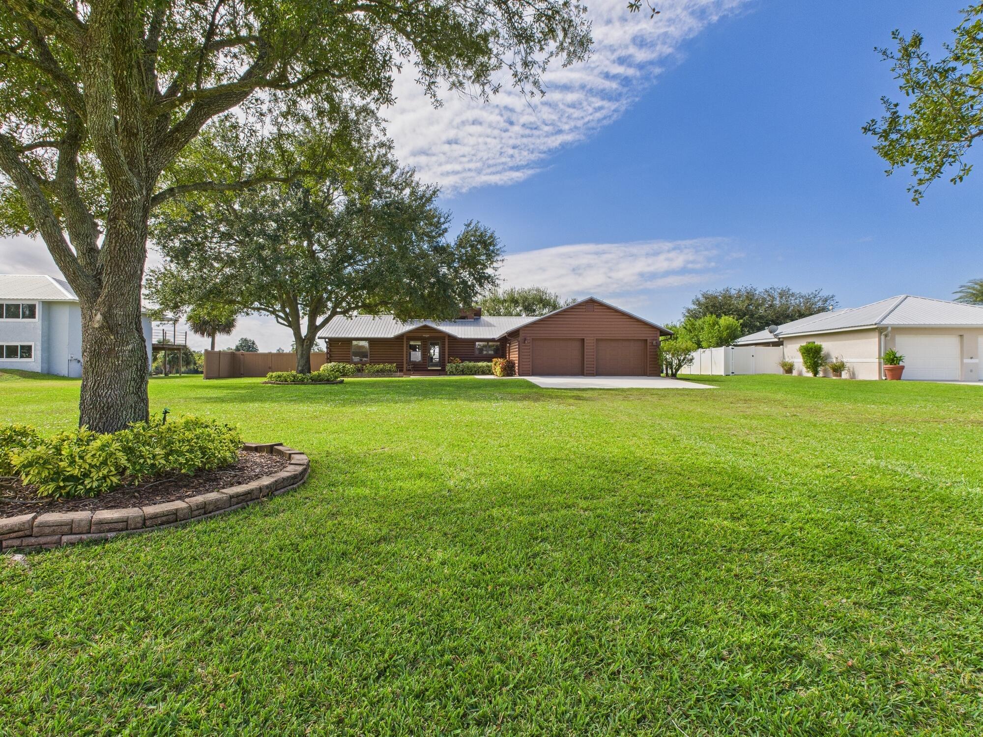 14266 Southwest 144th Parkway Okeechobee, FL 34974 - Photo 3 of 63 a view of a house with a yard