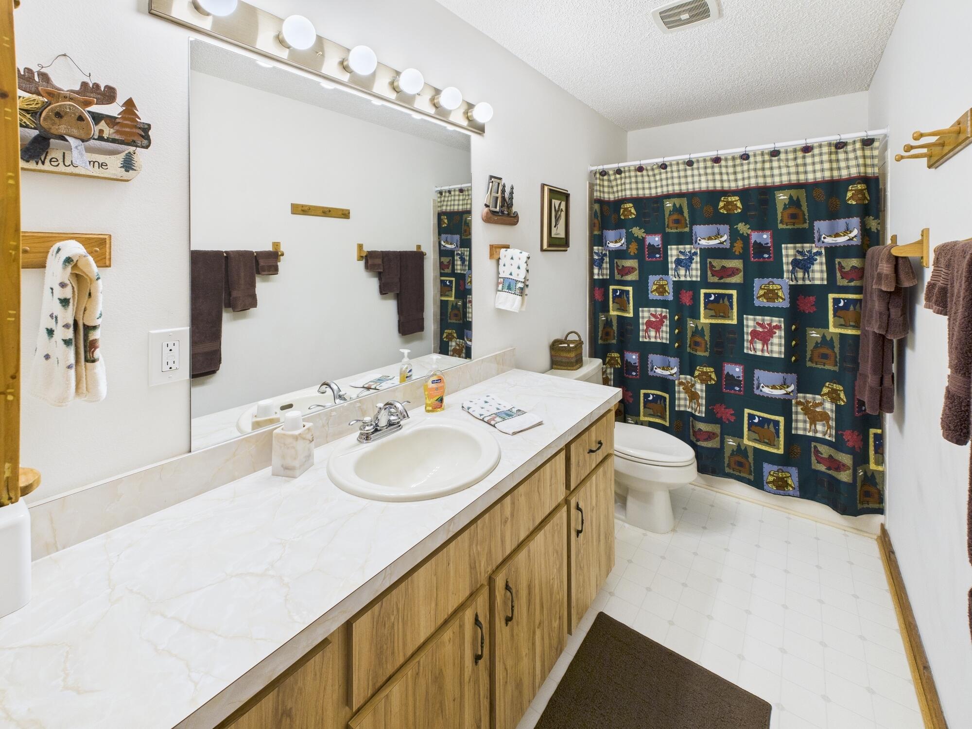 14266 Southwest 144th Parkway Okeechobee, FL 34974 - Photo 33 of 63 a en suite bathroom with a double vanity sink toilet and shower