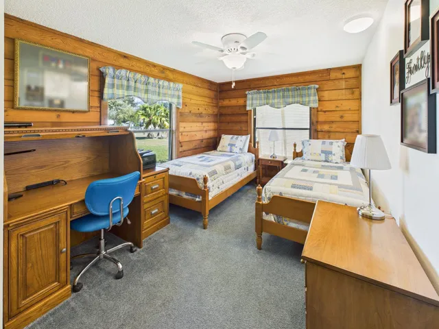 a view of an outdoor sitting area with brick walls