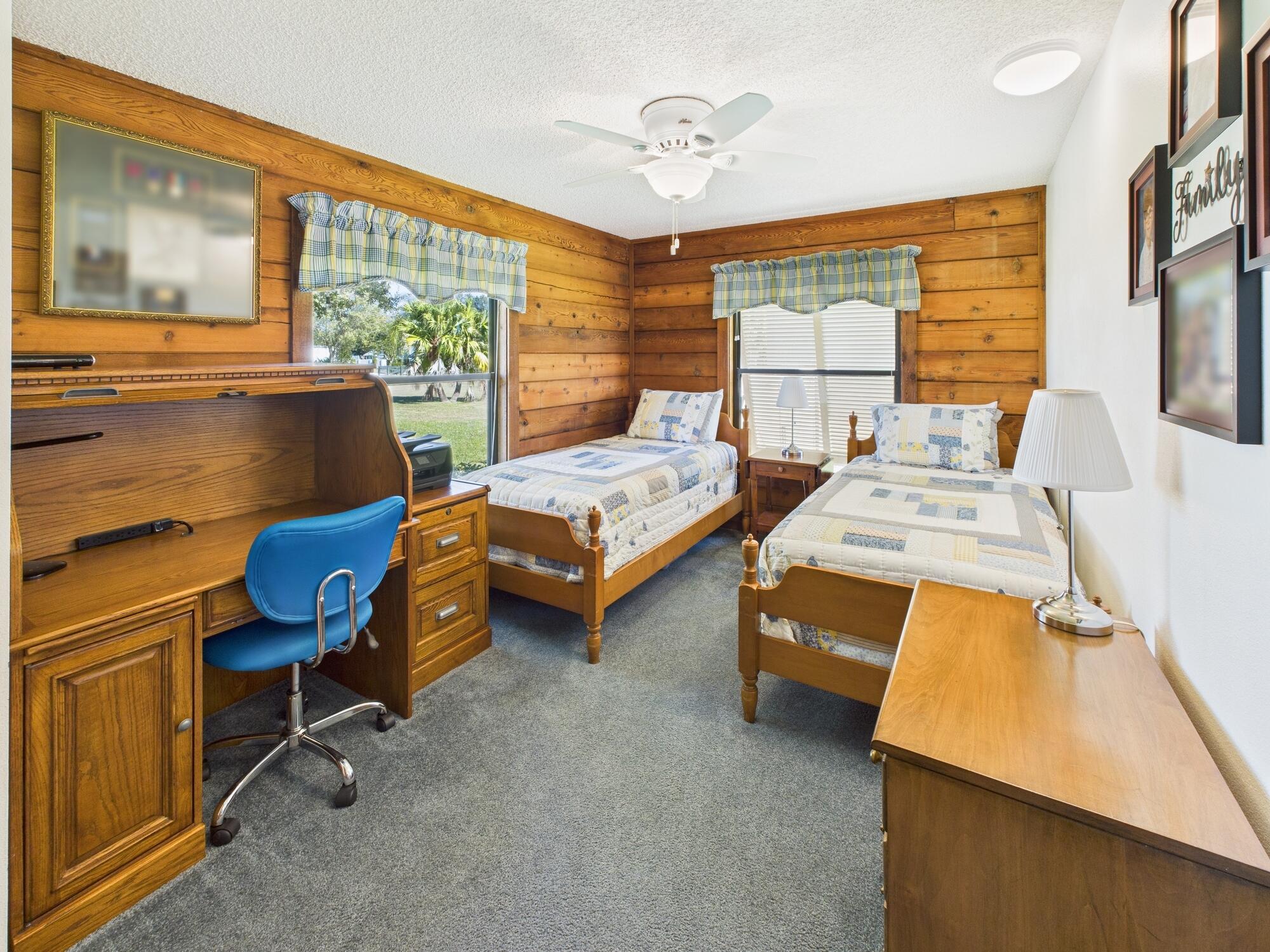 14266 Southwest 144th Parkway Okeechobee, FL 34974 - Photo 34 of 63 a bedroom with furniture and a window