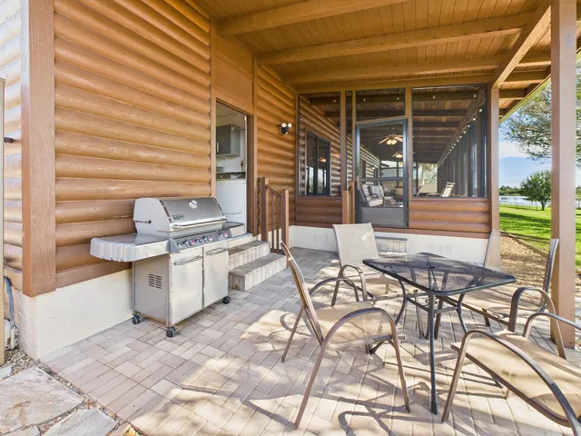 a utility room with cabinets washer and dryer