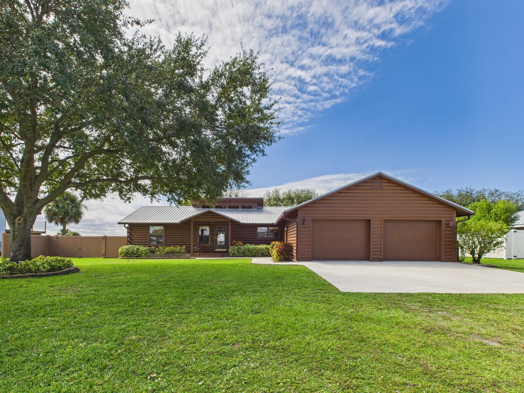14266 Southwest 144th Parkway Okeechobee, FL 34974 - Photo 4 of 63 a front view of house with garden