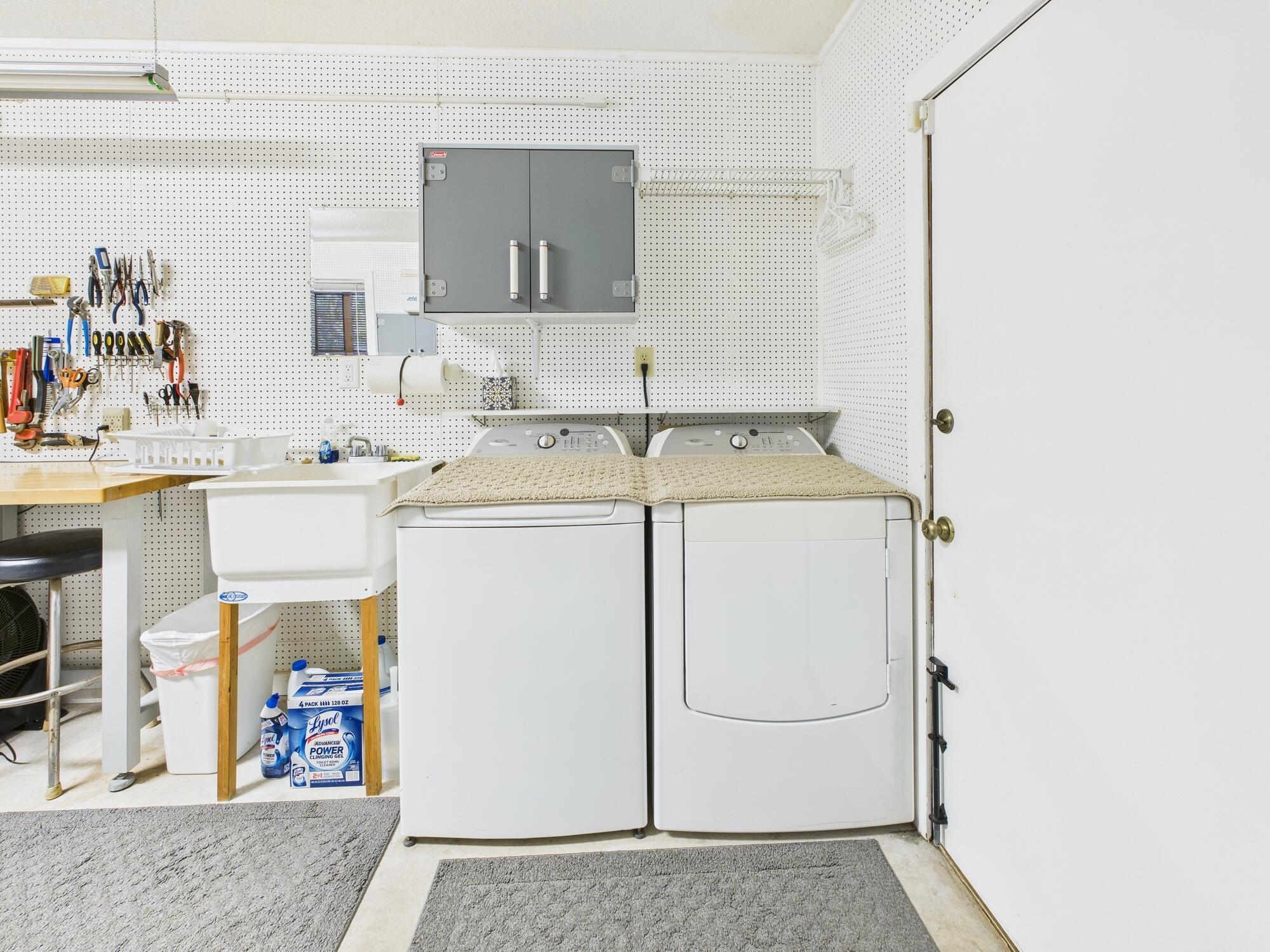 14266 Southwest 144th Parkway Okeechobee, FL 34974 - Photo 42 of 63 a utility room with cabinets washer and dryer