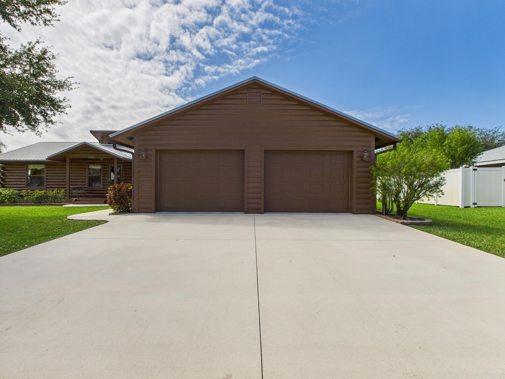 14266 Southwest 144th Parkway Okeechobee, FL 34974 - Photo 5 of 63 a house with a yard