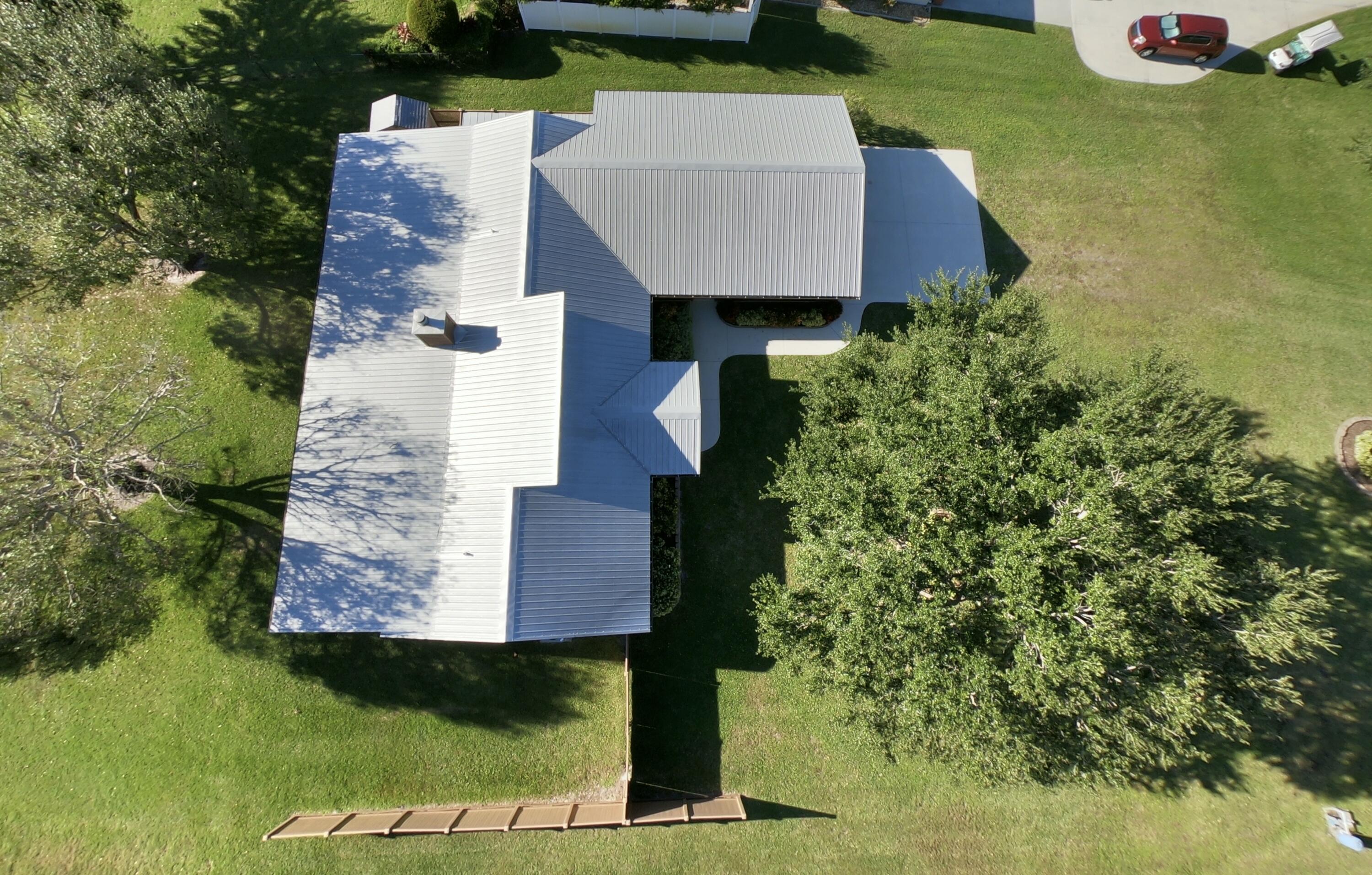 14266 Southwest 144th Parkway Okeechobee, FL 34974 - Photo 61 of 63 an aerial view of a house with garden space and street view