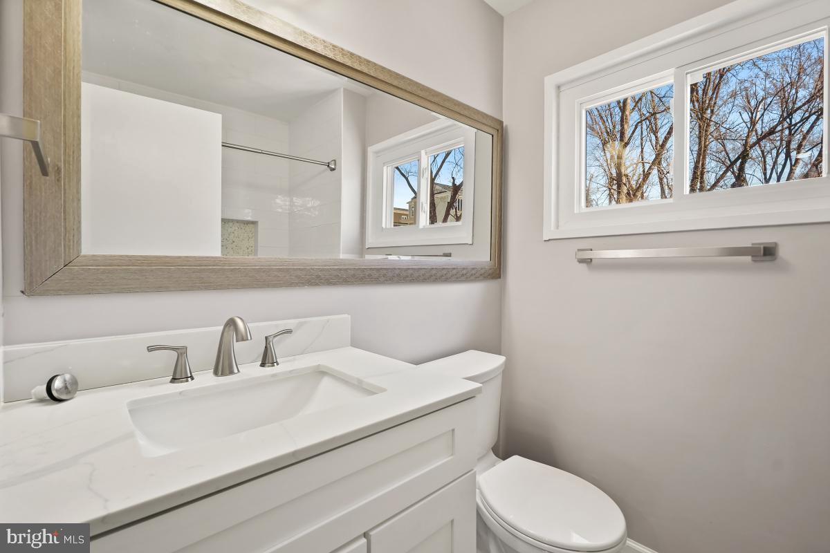4213 Allison Circle Fairfax, VA 22030 - Photo 16 of 22 a bathroom with a sink mirror and toilet