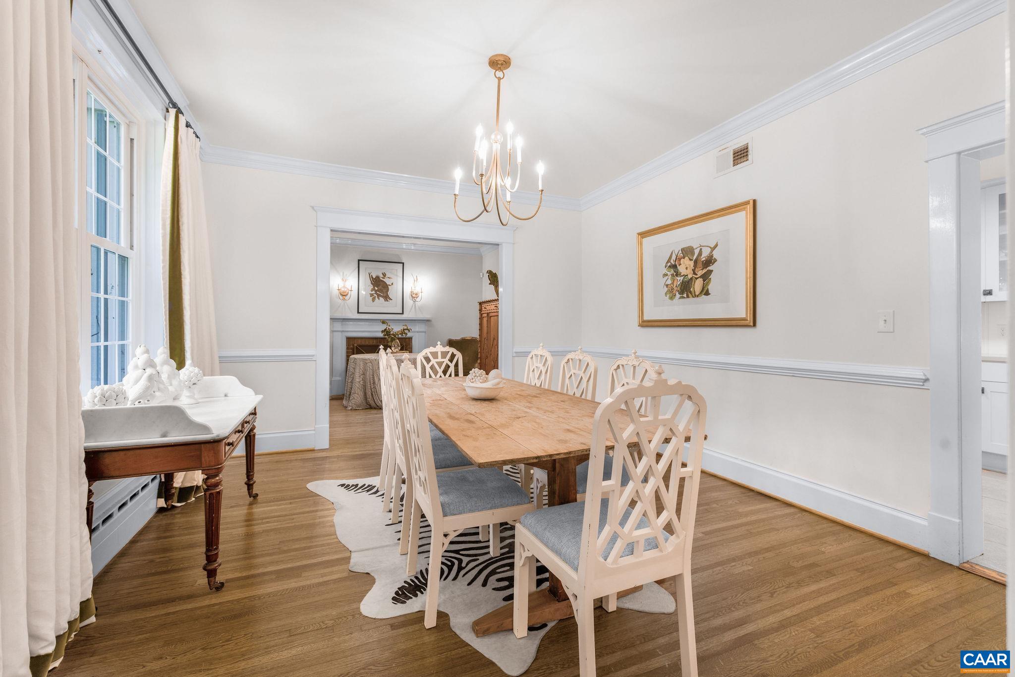 1204 Blue Ridge Road Charlottesville, VA 22903 - Photo 18 of 51 a view of a dining room with furniture wooden floor and a chandelier
