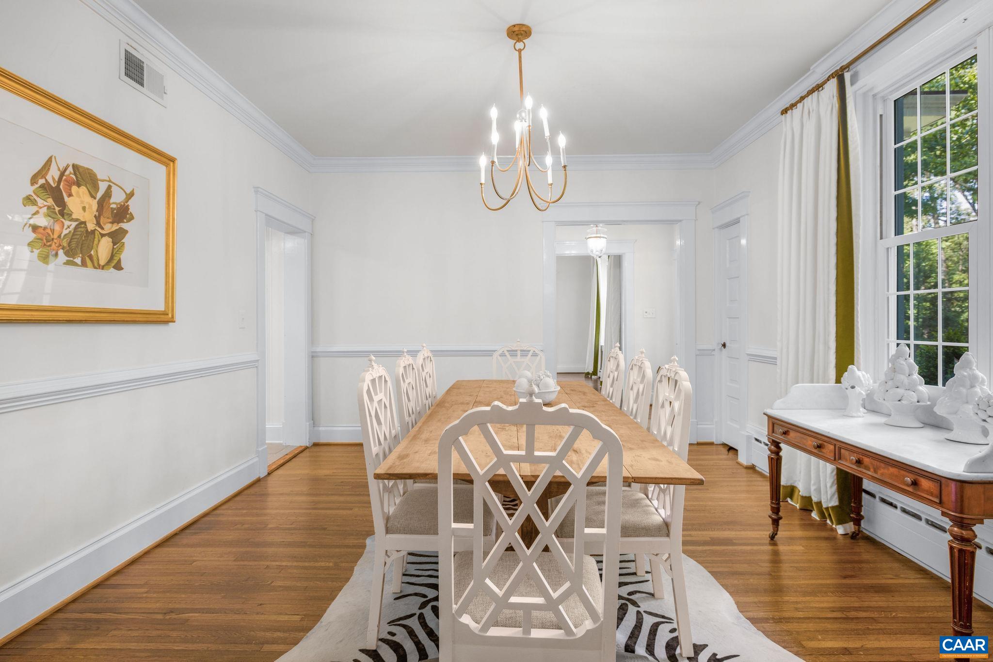 1204 Blue Ridge Road Charlottesville, VA 22903 - Photo 19 of 51 a view of a dining room with furniture window and wooden floor