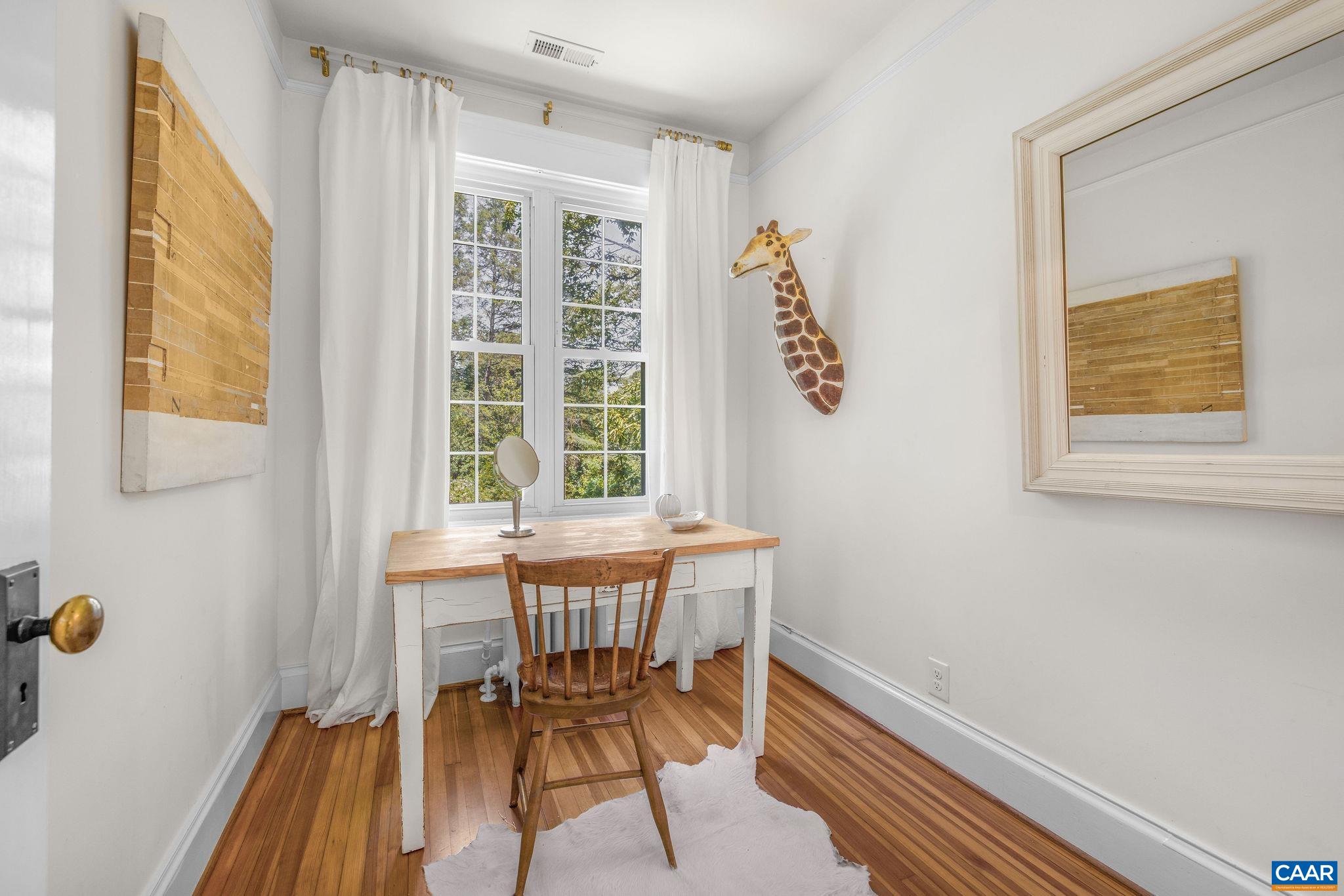 1204 Blue Ridge Road Charlottesville, VA 22903 - Photo 46 of 51 a dining room with furniture and a window