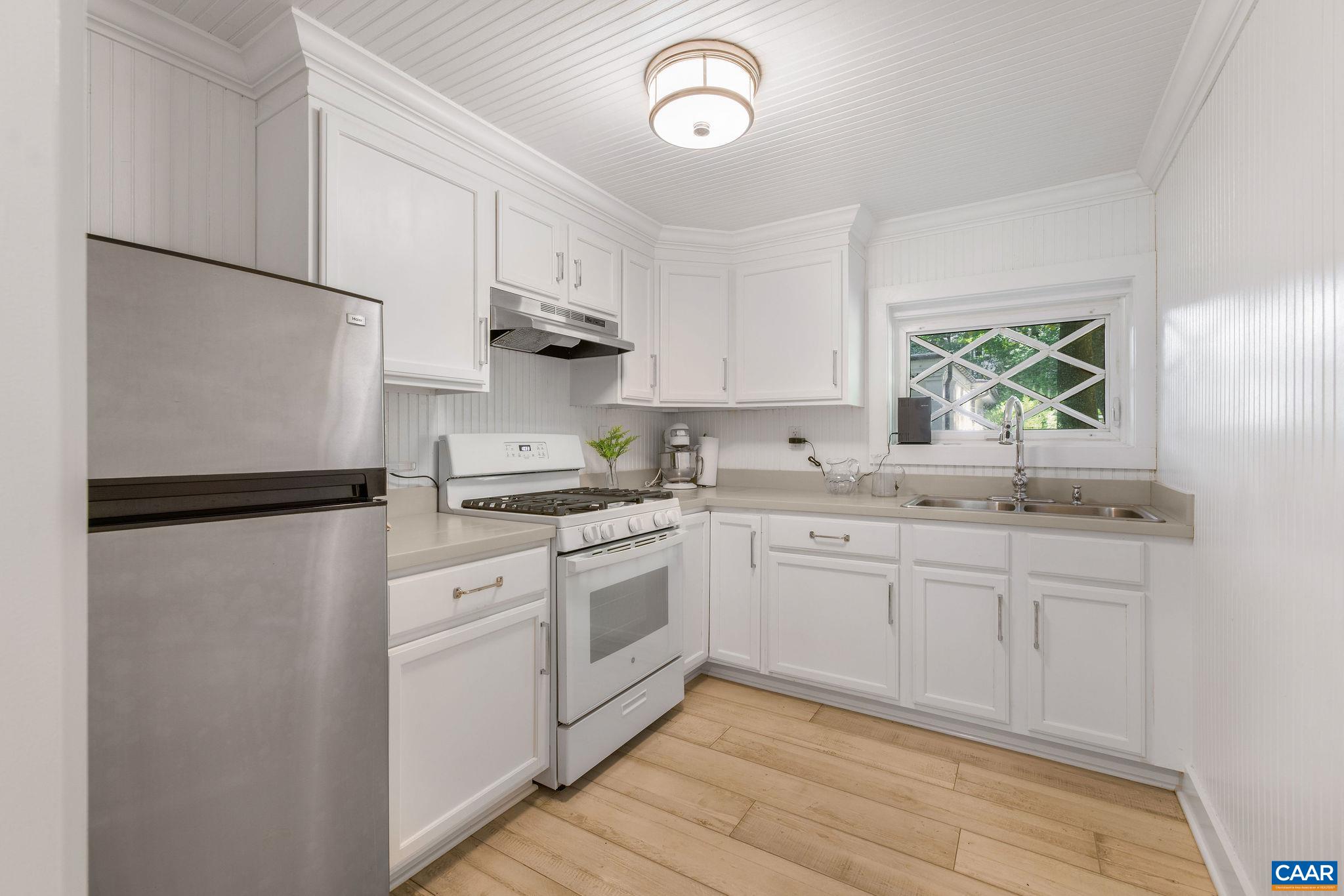 1204 Blue Ridge Road Charlottesville, VA 22903 - Photo 51 of 51 a kitchen with stainless steel appliances granite countertop a refrigerator sink and stove