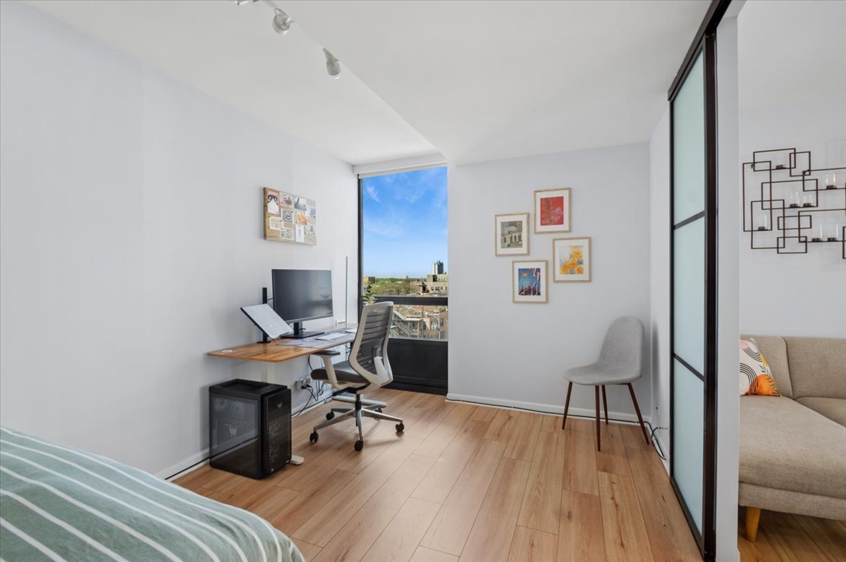 5320 North Sheridan Road, Unit 708 Chicago, IL 60640 - Photo 12 of 19 a view of a workspace with furniture and a workspace