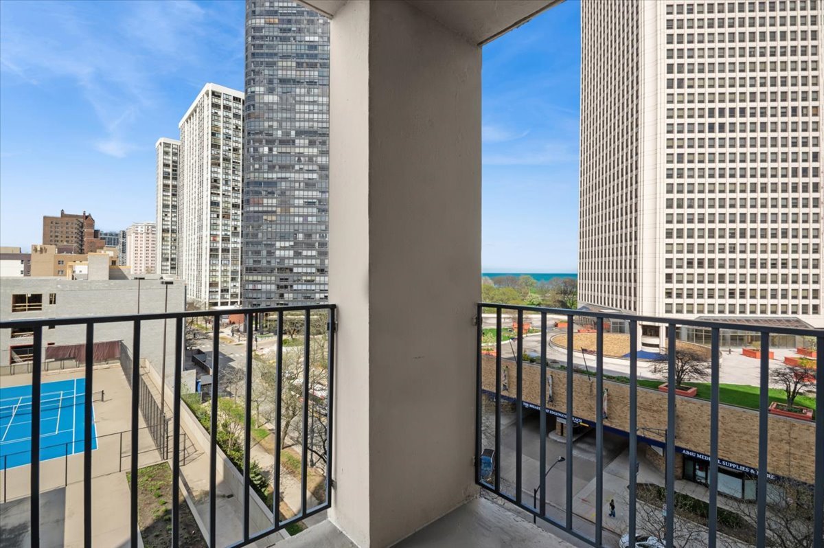 5320 North Sheridan Road, Unit 708 Chicago, IL 60640 - Photo 8 of 19 a view of balcony with a floor to ceiling window and brick wall