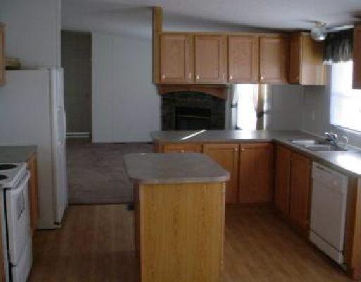 1274 Pike Road Montvale, VA 24122 - Photo 3 of 5 a kitchen with granite countertop a sink a stove and a refrigerator