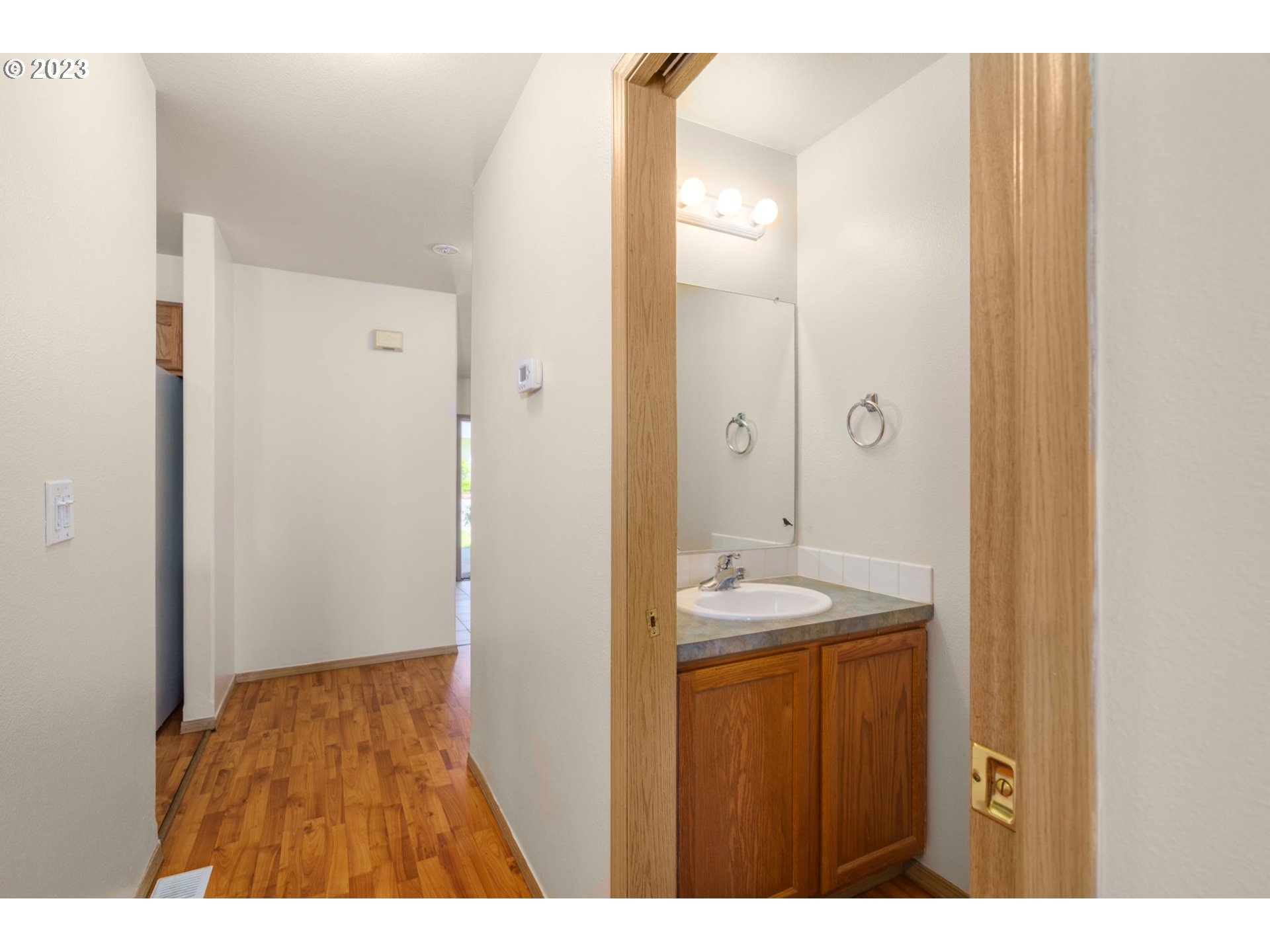 8342 Southeast Clinton Street Portland, OR 97266 - Photo 14 of 25 a bathroom with a sink and a mirror