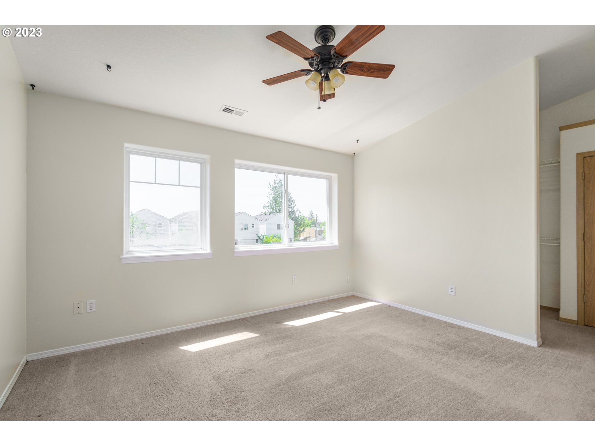 8342 Southeast Clinton Street Portland, OR 97266 - Photo 15 of 25 a view of an empty room with a window