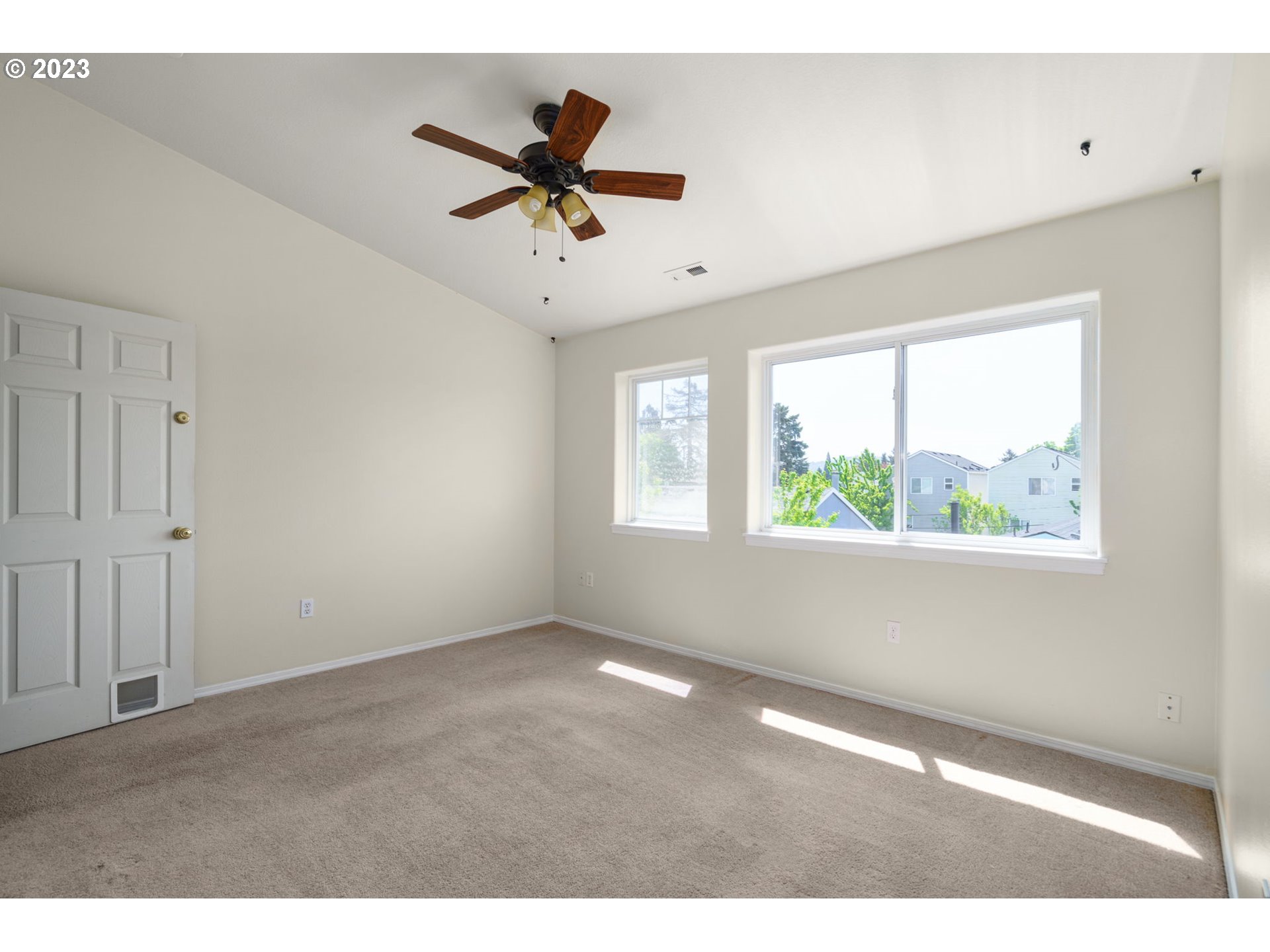 8342 Southeast Clinton Street Portland, OR 97266 - Photo 16 of 25 a view of an empty room with a window