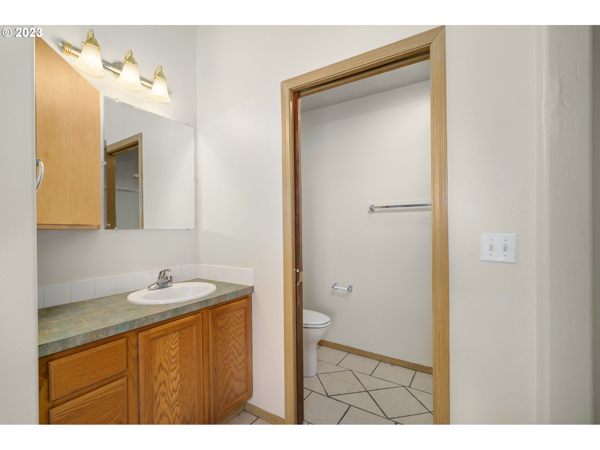 8342 Southeast Clinton Street Portland, OR 97266 - Photo 17 of 25 a bathroom with a sink and a mirror