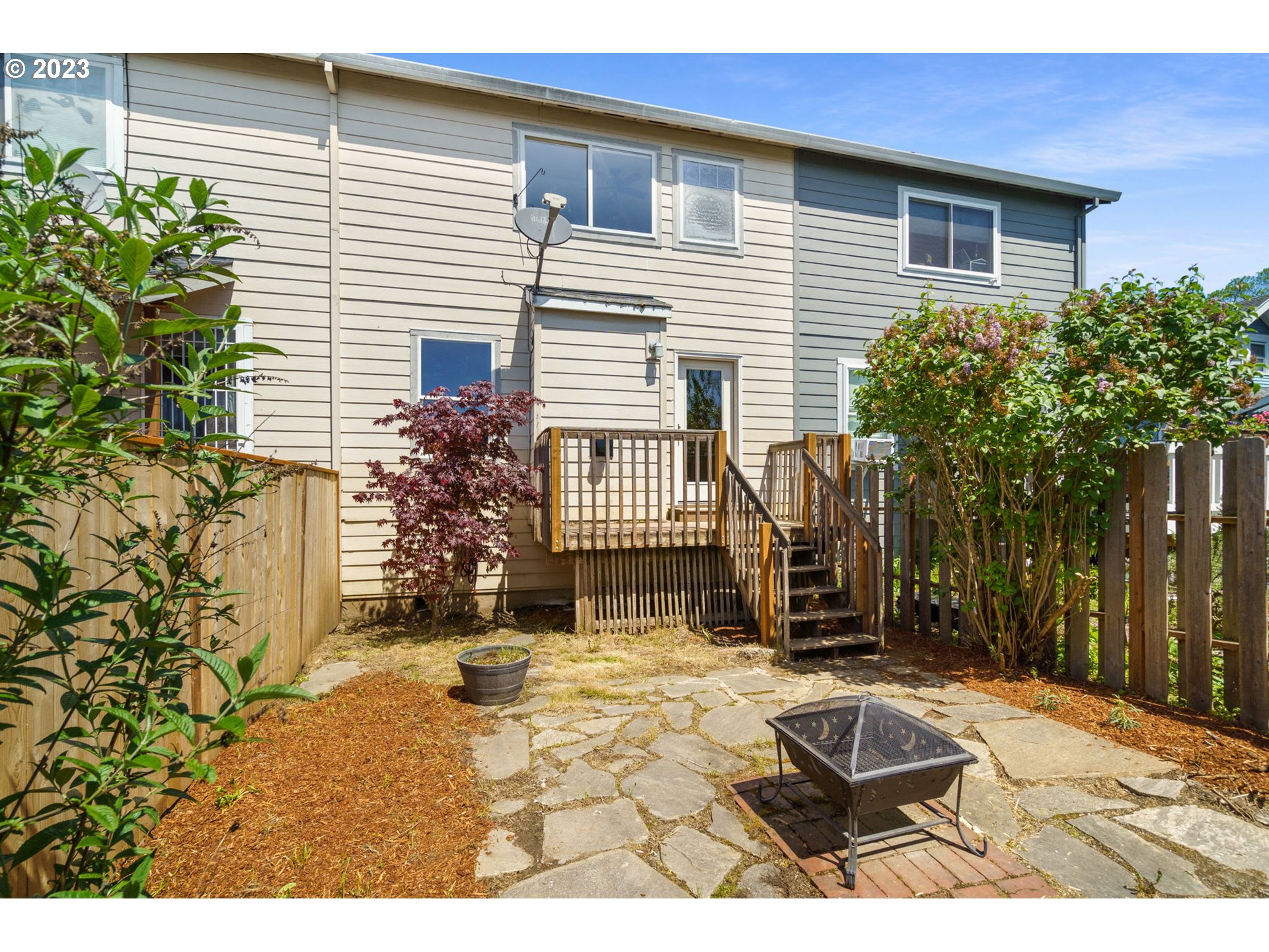 8342 Southeast Clinton Street Portland, OR 97266 - Photo 23 of 25 a backyard of a house with yard and outdoor seating