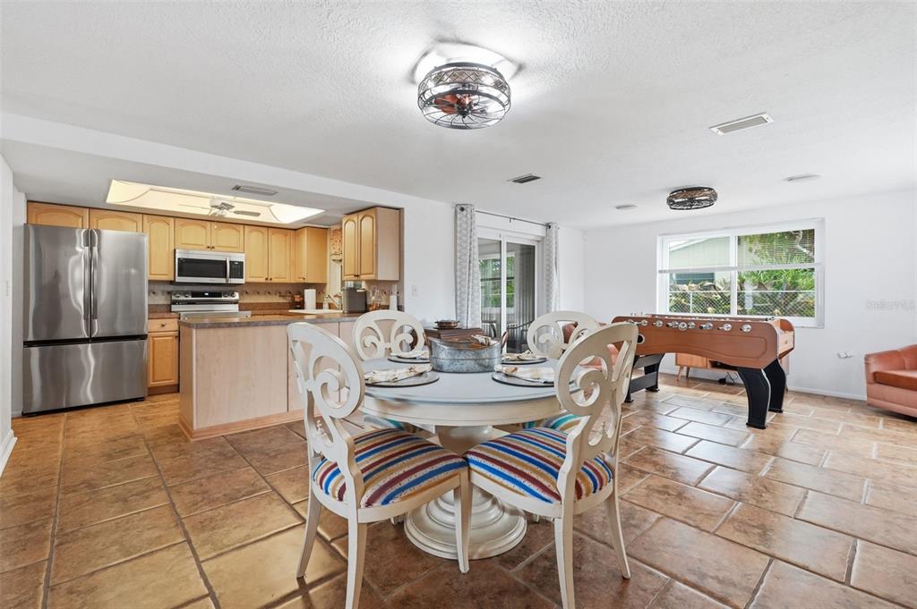 9420 Glen Moor Lane Port Richey, FL 34668 - Photo 17 of 36 a view of a dining room with furniture