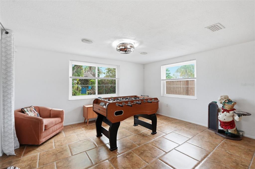 9420 Glen Moor Lane Port Richey, FL 34668 - Photo 19 of 36 a living room with furniture and a window