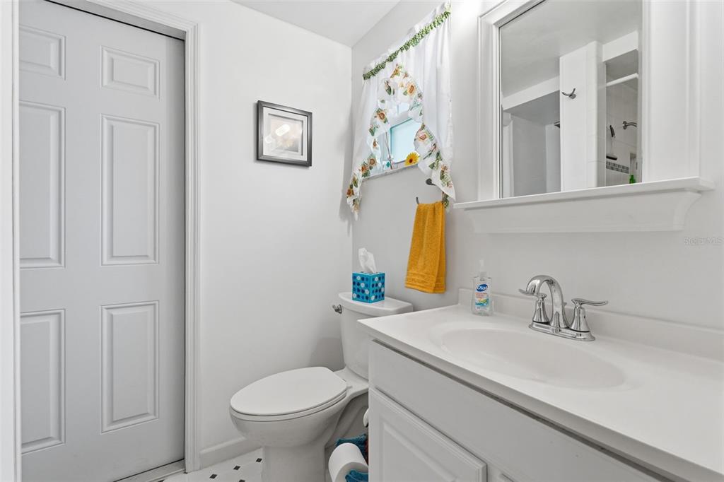 9420 Glen Moor Lane Port Richey, FL 34668 - Photo 25 of 36 a bathroom with a sink toilet and a mirror
