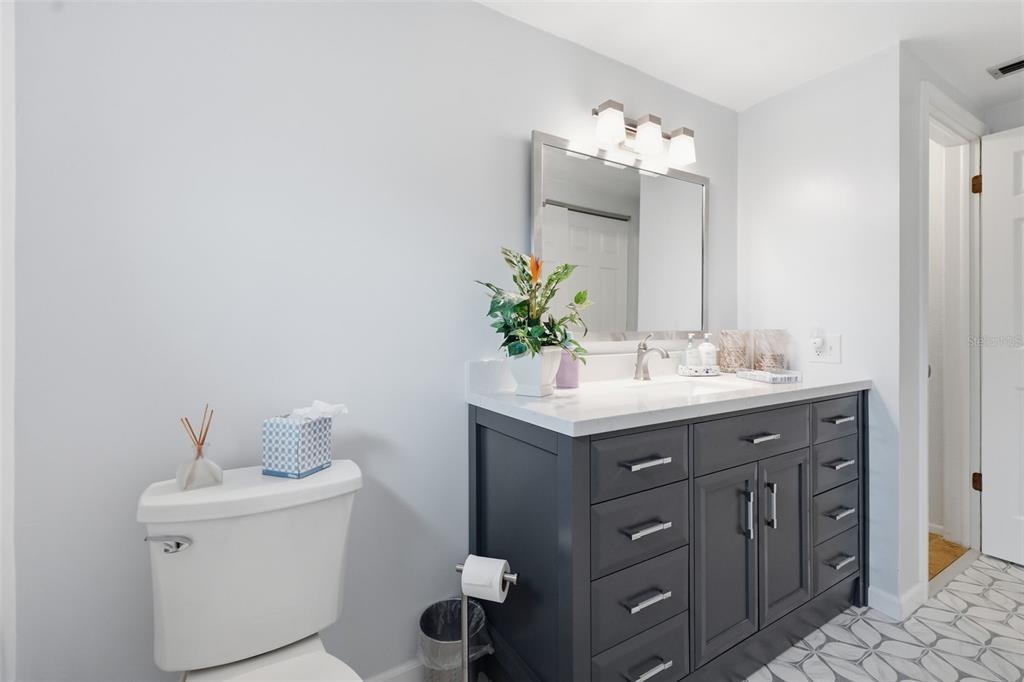 9420 Glen Moor Lane Port Richey, FL 34668 - Photo 30 of 36 a bathroom with a sink and a mirror